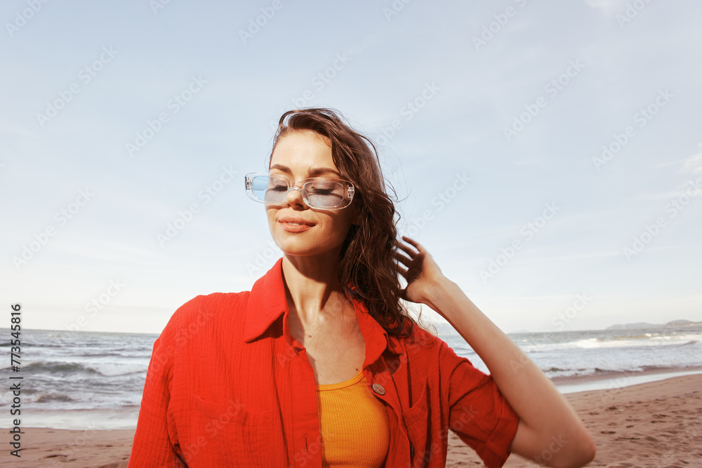Sunset Serenity: A Smiling Woman's Colourful Portrait at the Beach Sunset Serenity: A Smiling Woman's Colourful Portrait at the Beach