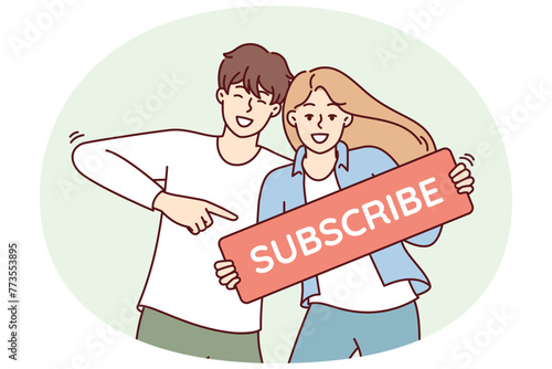 Beautiful couple of man and woman smile show subscribe sign call on viewers to action. Young family of bloggers or influencers standing inviting people to become blog followers