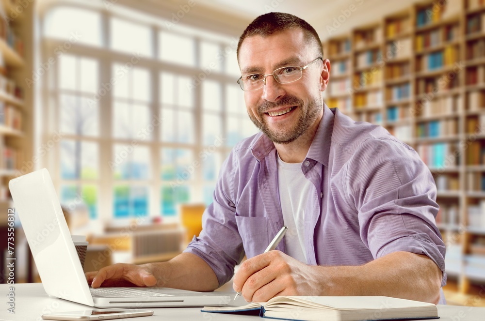 Happy student teenage prepare studying in library Happy student teenage prepare studying in library