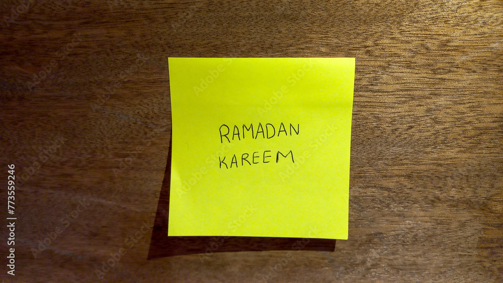 Ramadan Kareem Sticky Note on Wooden Background Ramadan Kareem Sticky Note on Wooden Background