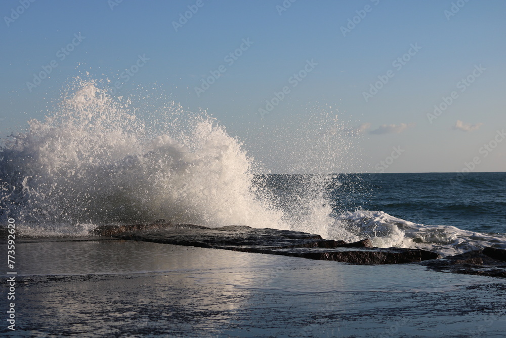 Fototapeta premium waves lapping against the levee