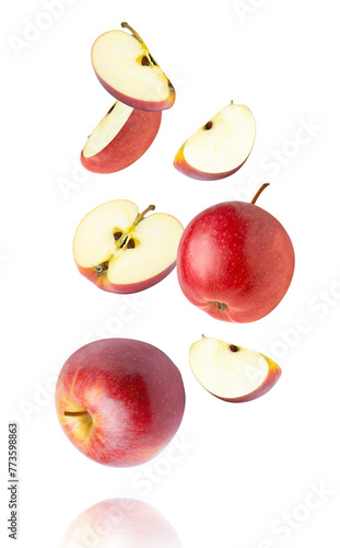 Red apple with slice flying isolated on white background.