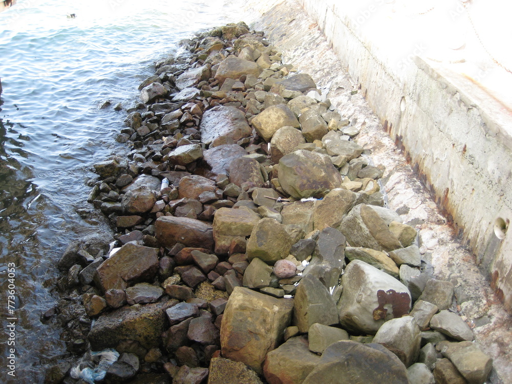 Fototapeta premium rocks protecting and supporting a seawall