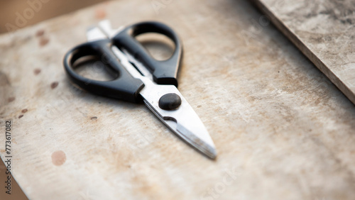 Scissors on a table in a carpentry workshop, close-up