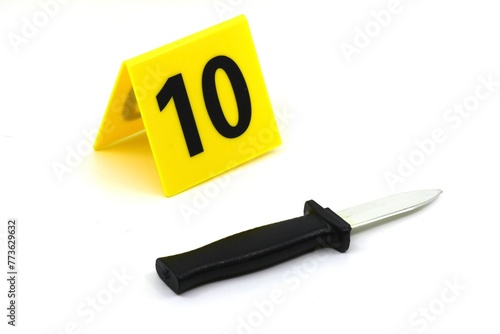 Foto Evidence marker on a crime scene weapon