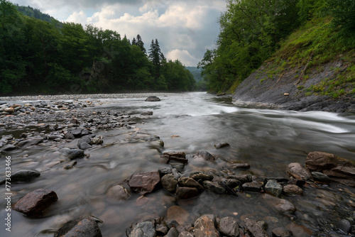 Belaya River canyon on the territory of the Caucasian Biosphere Reserve on the Guzeripl cordon on a sunny summer day with clouds, Guzeripl, Republic of Adygea, Russia photo