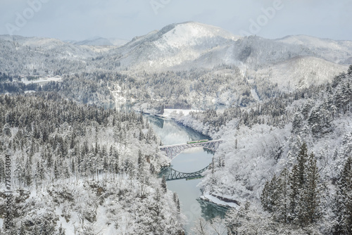 Panoramic Winter View Of Tadami Railway Line Train And Bridge Reflection In The Beautiful Valley Of Tadami River, Mishima Machi, Aizu Kawaguchi, Fukushima, Japan photo