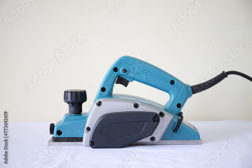 Wood electric planer machine isolated on white background. An electric tool planer machine for wood.	
