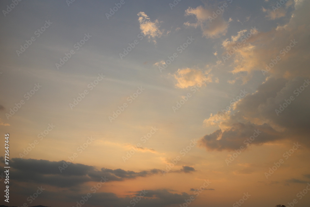 Colorful cloudy sky at sunset. golden color. Sky texture, abstract nature background