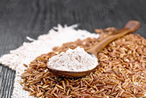 Flour red rice in spoon on board