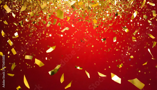 赤い背景に金の紙吹雪。金色の装飾。豪華な背景素材。Gold confetti on a red background. golden decoration. Luxurious background material. photo