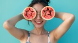 Cheerful Asian woman with watermelon star glasses against a turquoise background, epitomizing summer fun and healthy living. This vibrant stock image is ideal for seasonal campaigns