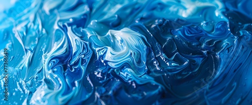 Abstract paint strokes in liquid blue, forming an intricate and captivating background.