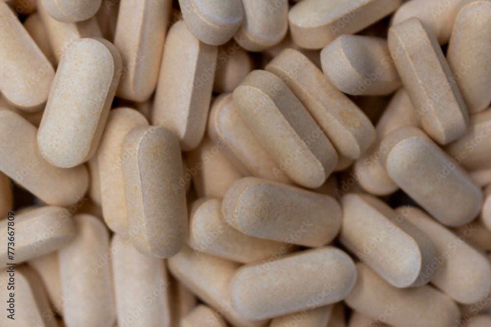 Top view of a variety of yellow pharmaceutical pills, vitamins, antibiotics, medicines manufactured according to the formulation and dosage form, pharmaceutical concept, close up, background Top view of a variety of yellow pharmaceutical pills, vitamins, antibiotics, medicines manufactured according to the formulation and dosage form, pharmaceutical concept, close up, background