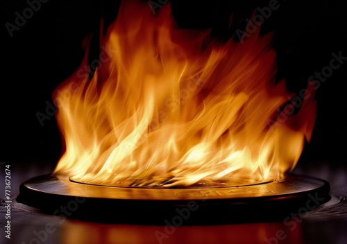 A close up of a fire with the flames reaching up to the top of the image