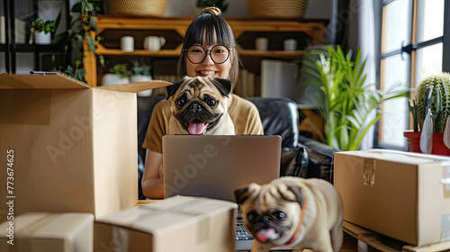 SME entrepreneur of Young women working with laptop for Online shopping at home with dog pug breed Cheerful and Happy with box for packaging in home Own Business Start up and work from home concept. photo