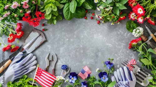 Gardening tools, gloves, and a variety of vibrant flowers displayed on a concrete background with American flags