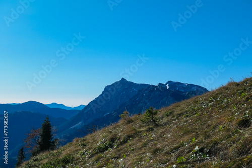 Panoramic view of majestic mountain peaks of Gesäuse seen from Hochblaser in Eisenerz Alps, Ennstal Alps, Styria, Austria. Idyllic hiking trail in remote Austrian Alps in summer. Wanderlust in nature