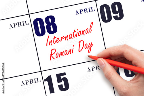 April 8. Hand writing text International Romani Day on calendar date. Save the date. © Alena