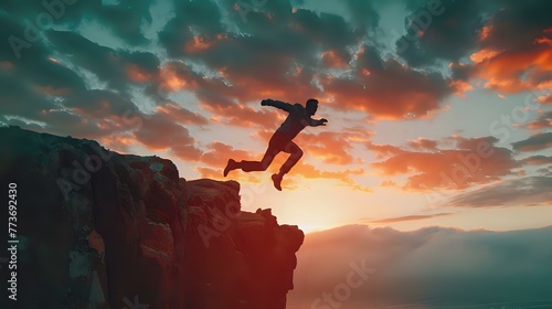 Daring Leap: Man Jumps Over Cliff Against Sunset Backdrop, Business Concept