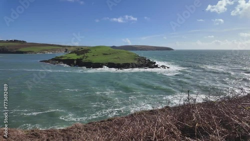 Windy sunny day at the coast of West Cork Ireland with waves and tide. Kinsale, Sandycove photo