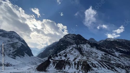 Snow filled mountains with blue skies landscape near Manali Kashmir Rothang pass India photo
