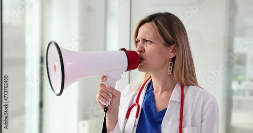 Doctor speaks into a megaphone about healthcare photo