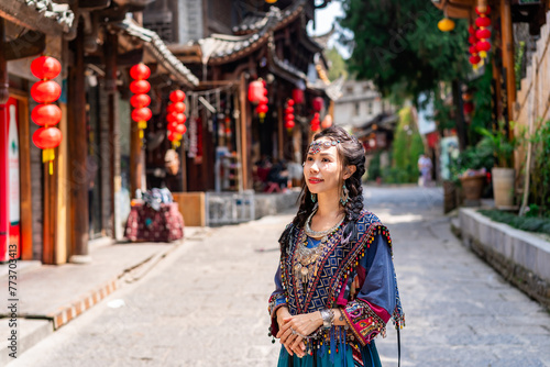 Young female tourist in traditional dress walking at Furong old Town, The famous tourist destination at Hunan Province, China
