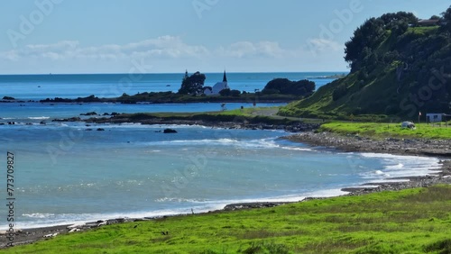 Aerial: Coastline and church in Raukokore, Bay of Plenty, New Zealand. photo