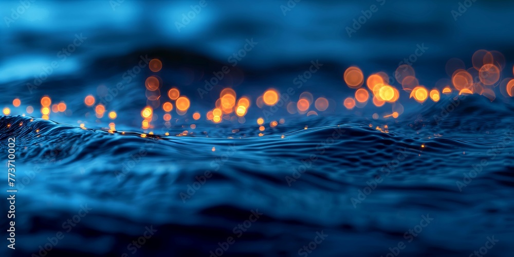 At night Dark blue water surface and orange lights with strong bokeh effect - obrazy, fototapety, plakaty 