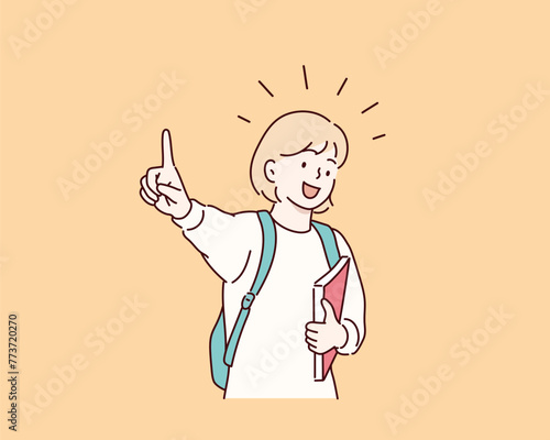 A child from school holds a textbook and points his finger up. Hand drawn style vector design illustrations.