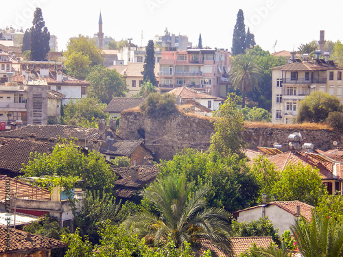 View from height of the minaret on the red tiled roofs of old houses in the old city of Antalya in Turkey photo