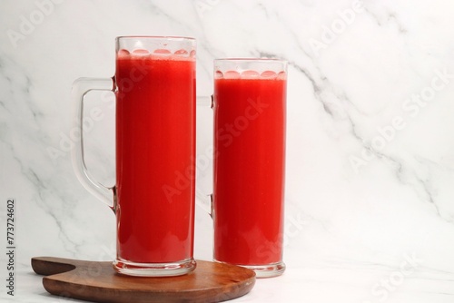 Fresh watermelon juice in a glass. Best summer drink to keep your body hydrated. It has a generous amount of water and vital nutrients, the watermelon juice has a cooling effect on our body. copyspace