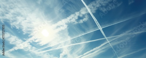 Sky with airplane contrails crossing