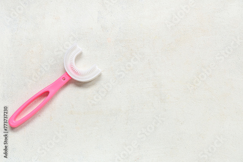 Children s toothbrush on white grunge background