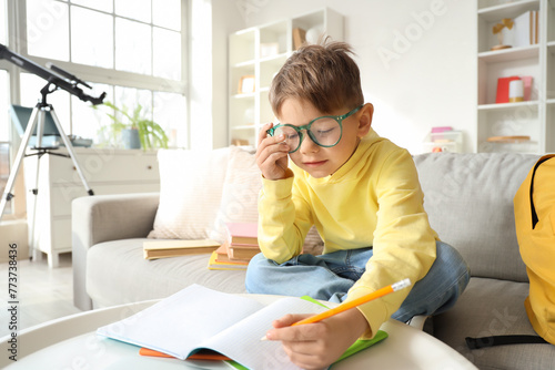 Cute little boy in eyeglass...