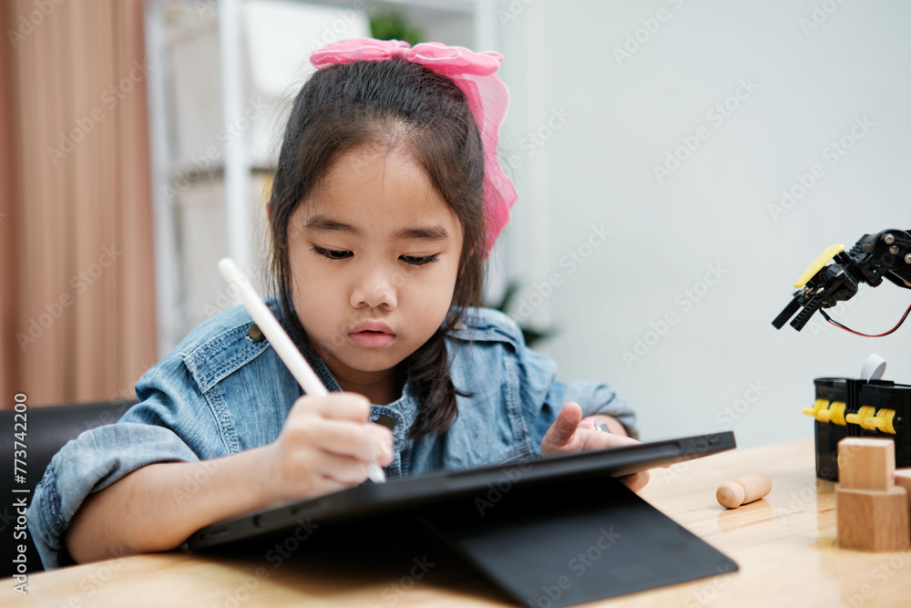 Young Girl Drawing on Digital Tablet with Stylus Pen Young Girl Drawing on Digital Tablet with Stylus Pen
