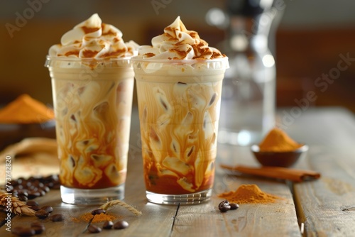Iced caramel macchiato in clear cups. Coffee shop beverages. Cold coffee drink concept for design and print