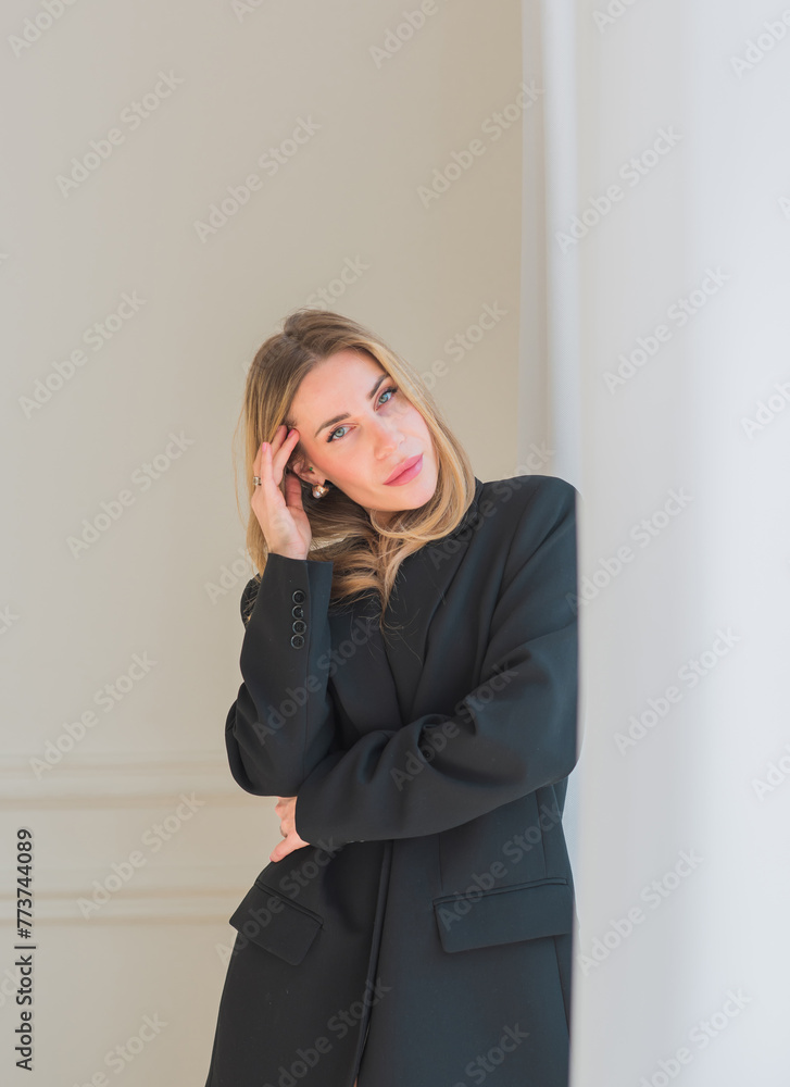 Business woman in black oversize jacket, fashionable outfit for work. Concept of modern lady lifestyle Business woman in black oversize jacket, fashionable outfit for work. Concept of modern lady lifestyle
