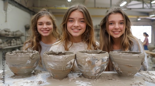 Teenagers embrace pottery, shaping clay into art with passion and precision, discovering creativity in every spin of the wheel.
 photo