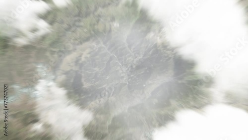 Earth zoom in from space to La Massana, Andorra. Followed by zoom out through clouds and atmosphere into space. Satellite view. Travel intro. Images from NASA photo