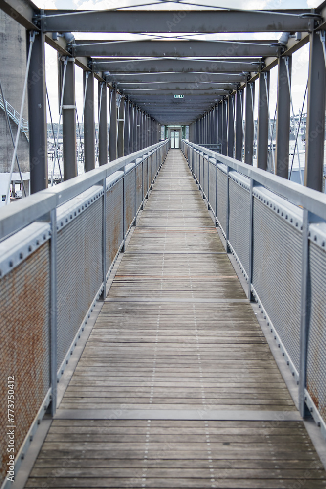Metal and wooden bridge in the city, industrial city structures, interesting graphics