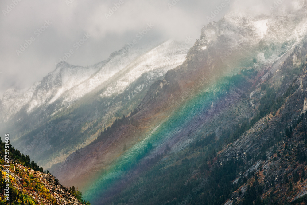 Rainbow over Blodgett Canyon mountains in Hamilton, MT