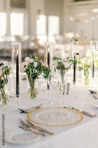 Luxurious wedding table with gold accents and florals
