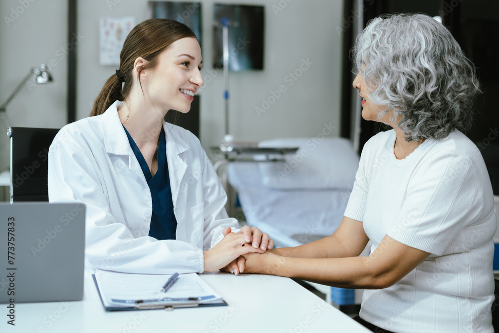 Female doctors shake hands with patients encouraging each other To offer love, concern, and encouragement while checking the patient's health. Concept Health care and Social Security Female doctors shake hands with patients encouraging each other To offer love, concern, and encouragement while checking the patient's health. Concept Health care and Social Security