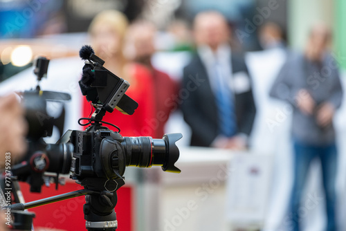 Cameraman strategically positioned to capture every moment of the opening ceremony with precision