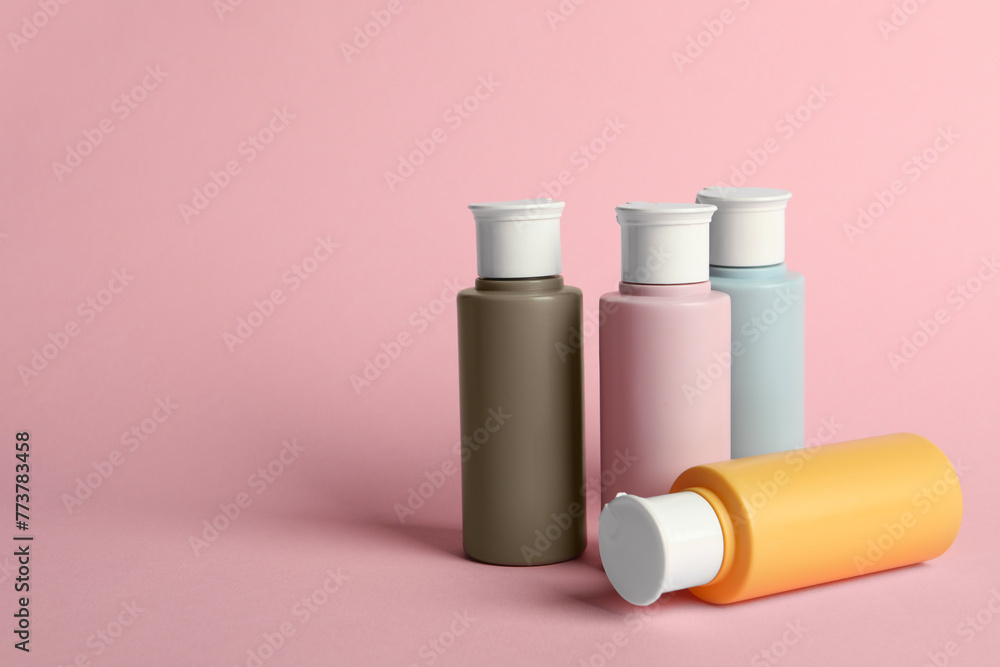 Cosmetic travel on pink background. Space for text Cosmetic travel on pink background. Space for text