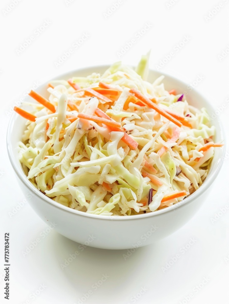 A bowl of coleslaw with shredded carrots and celery A bowl of coleslaw with shredded carrots and celery