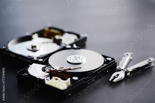 Computer accessories. The disassembled hard drive. Repair of components PC. Broken external hard drive. Computer background.