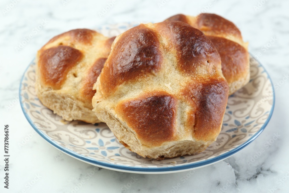 Hot cross buns on white marble table, closeup Hot cross buns on white marble table, closeup